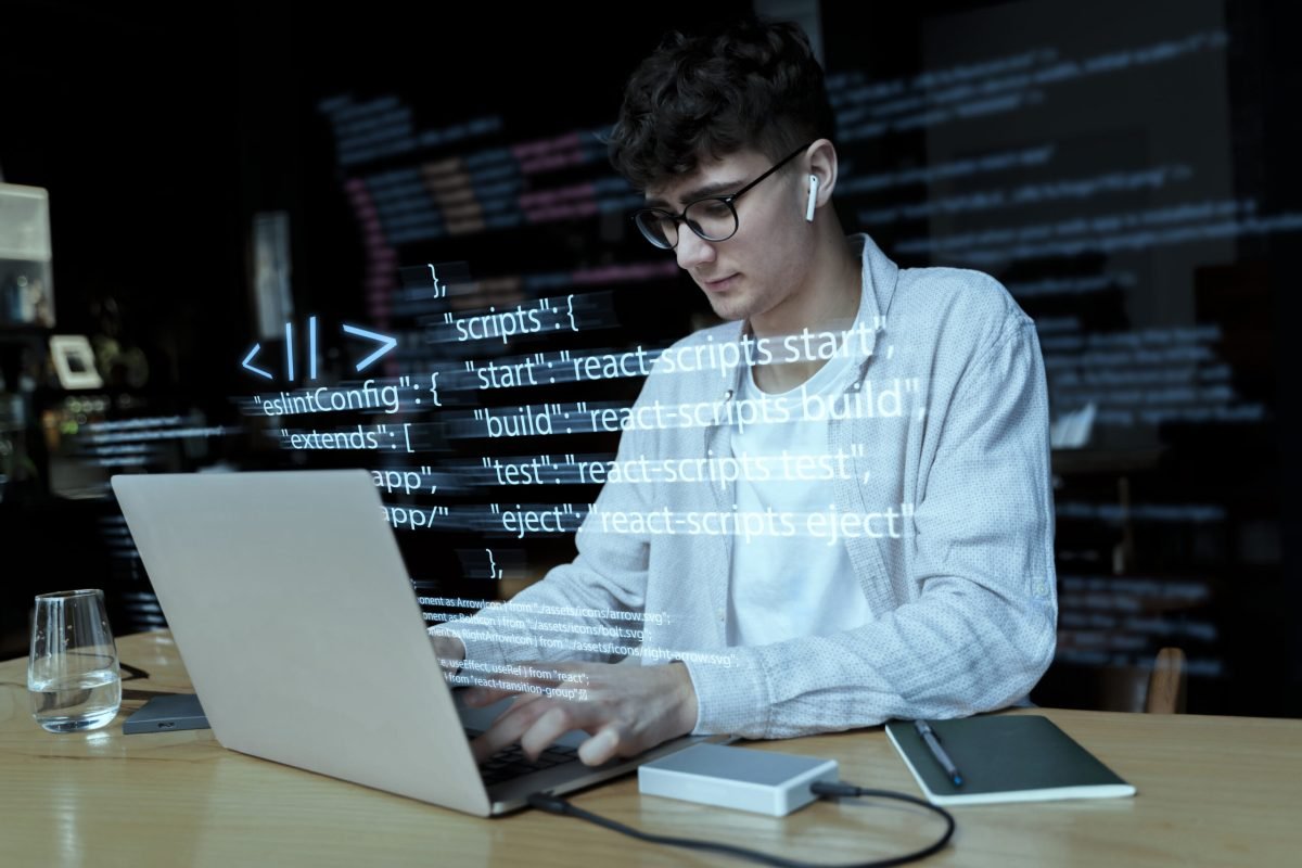 programming-background-with-person-working-with-codes-computer
